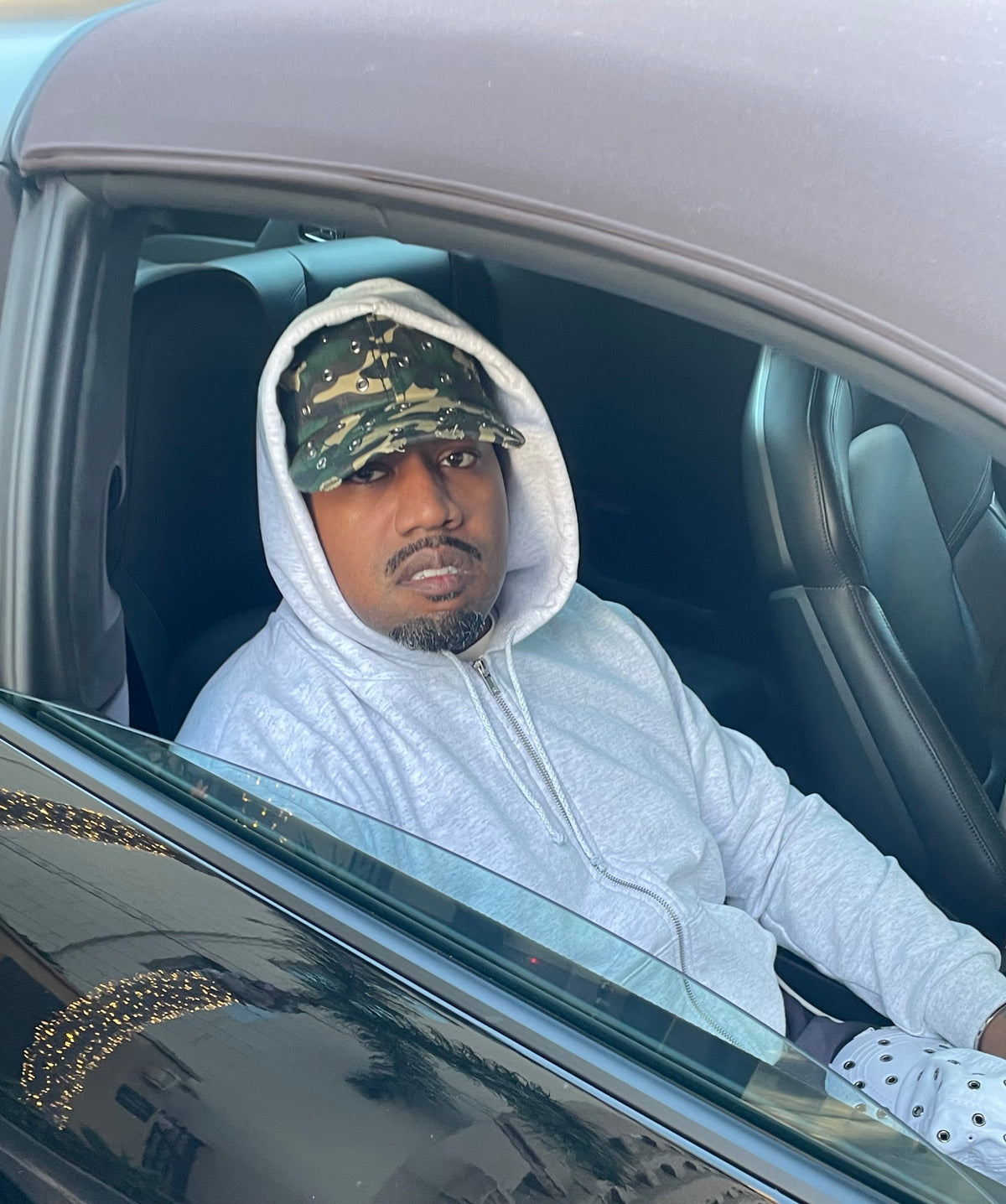 Ye wearing the metal stabbed thrash hat